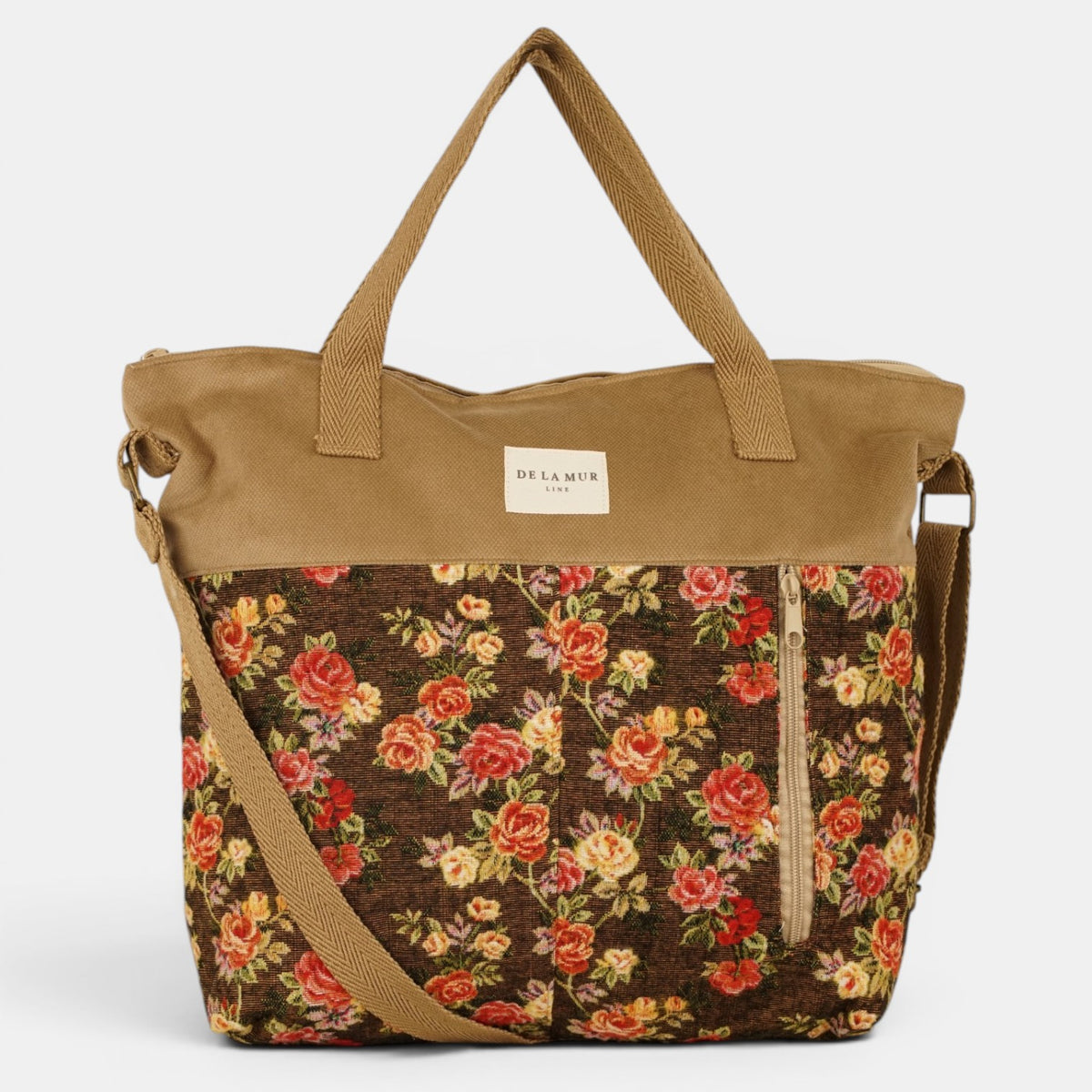 Bolso Pepi, estampado en naranja, terracota, negro, detalle del material y el acabado — De La Mur