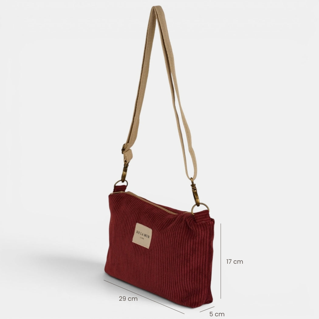 Bolso clutch Arde, estampado en rojo, negro, blanco, detalle del material y el acabado — De La Mur