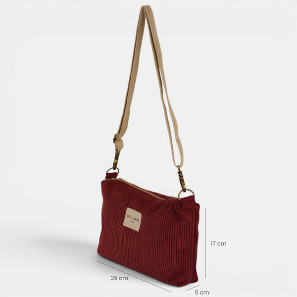 Bolso clutch Arde, estampado en rojo, negro, blanco, detalle del material y el acabado — De La Mur