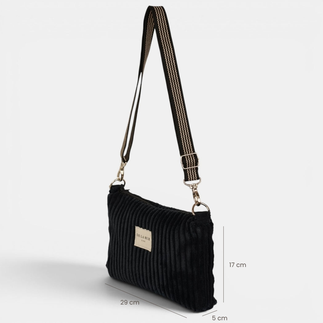 Bolso clutch Curly, estampado en beige, azul, negro, detalle del material y el acabado — De La Mur