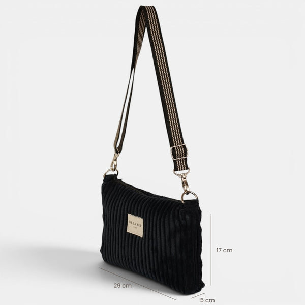 Bolso clutch Curly, estampado en beige, azul, negro, detalle del material y el acabado — De La Mur
