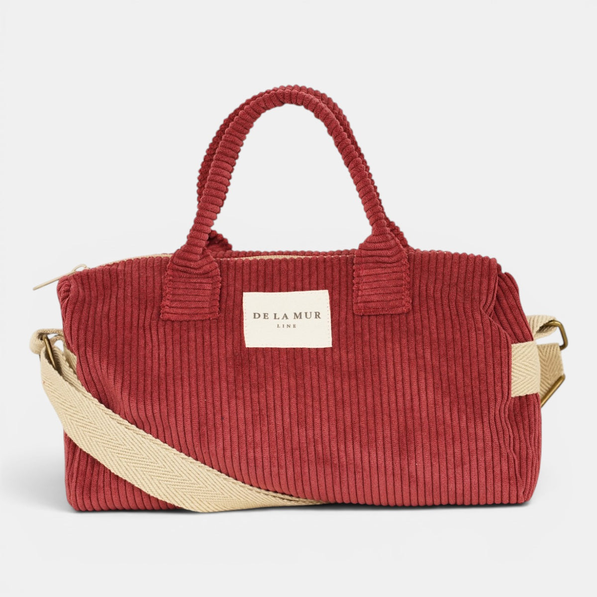 Bolso Arde, estampado en rojo, beige, blanco, detalle del estampado y el material — De La Mur