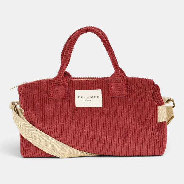 Bolso Arde, estampado en rojo, beige, blanco, detalle del estampado y el material — De La Mur