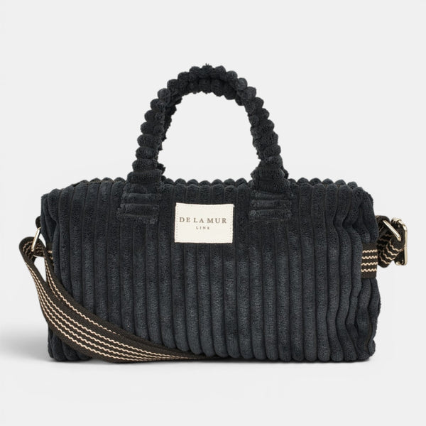 Bolso Curly, estampado en beige, negro, blanco, detalle del material y el acabado — De La Mur