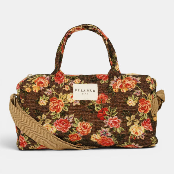 Bolso Pepi, estampado en naranja, negro, beige, detalle del material y el acabado — De La Mur