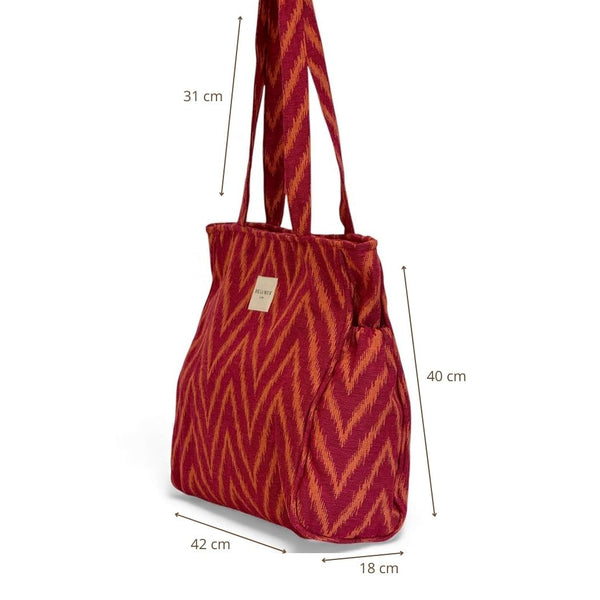 Bolsa con cremallera Fuego, estampado en rojo, naranja y amarillo, detalle del material y el acabado — De La Mur