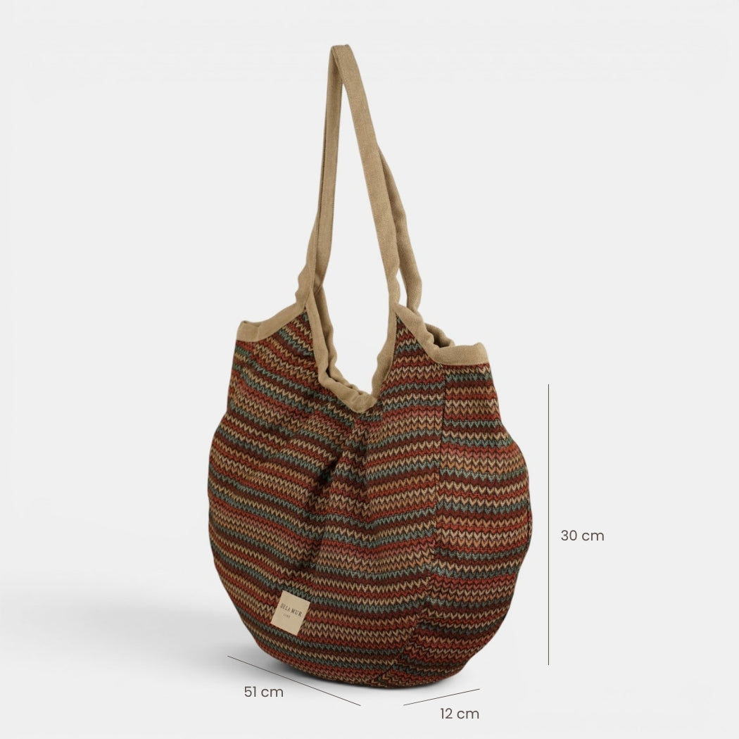 Bolso Fron, estampado en beige, azul, terracota, detalle del material y el acabado — De La Mur
