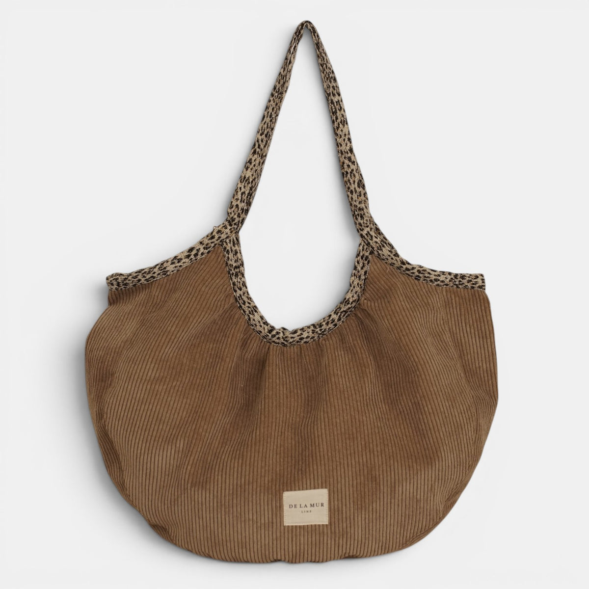Bolso Toast, estampado en blanco, beige, rojo, detalle del estampado y el material — De La Mur