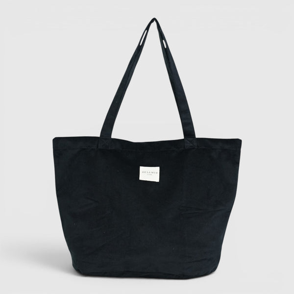 Bolsa grande con cremallera Aza, acabado negro, vista frontal — De La Mur
