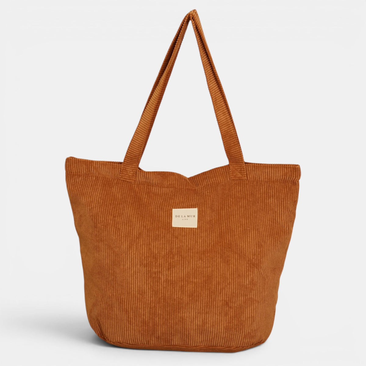 Bolsa grande con cremallera Barro, estampado en blanco, beige, terracota, detalle del estampado y el material — De La Mur