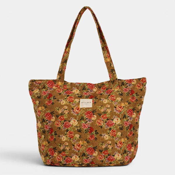 Bolsa grande con cremallera Esme, estampado en beige, naranja, terracota, detalle del estampado y el material — De La Mur