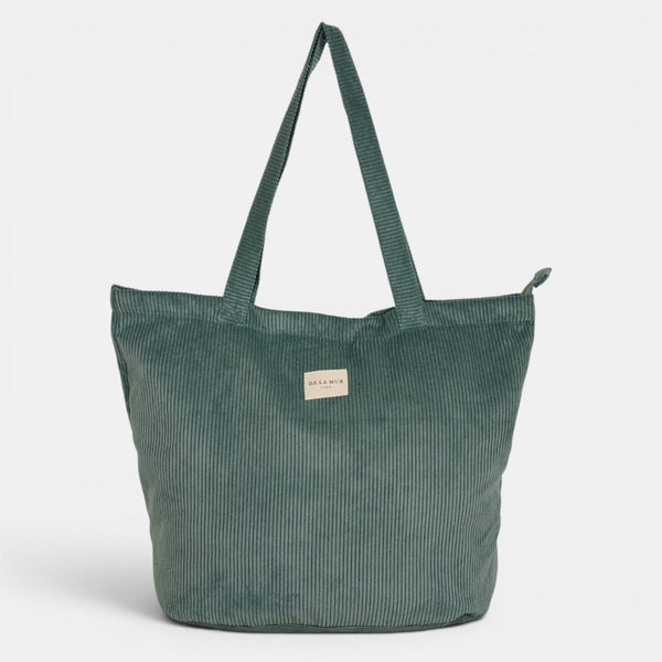 Bolsa grande con cremallera Jade, acabado verde jade, detalle del estampado y el material — De La Mur