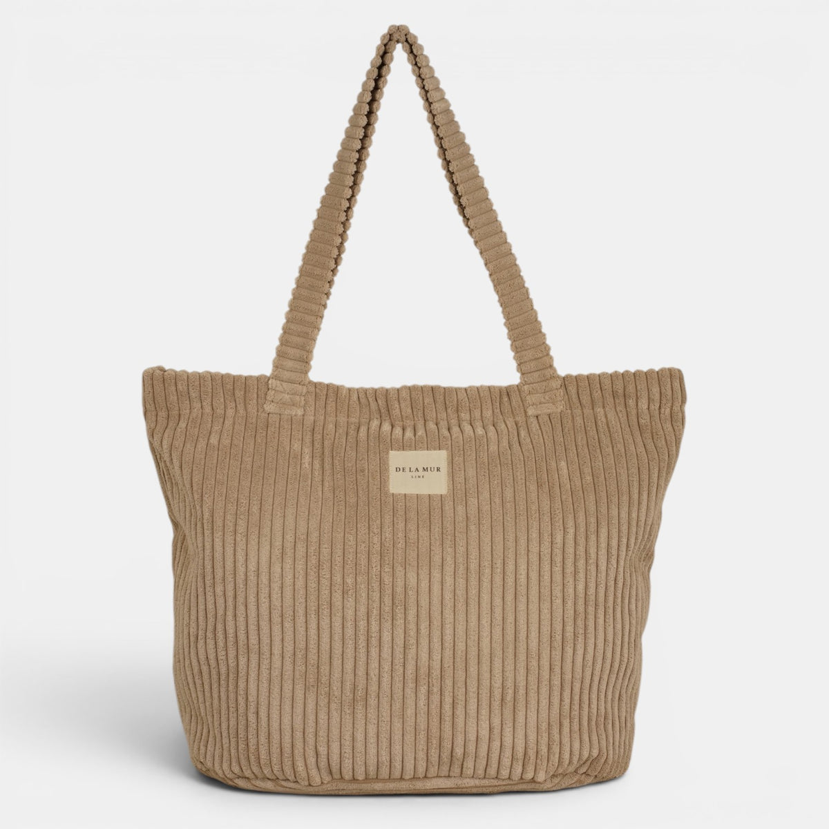 Bolsa grande con cremallera Moka, estampado en beige, negro, naranja, detalle del estampado y el material — De La Mur