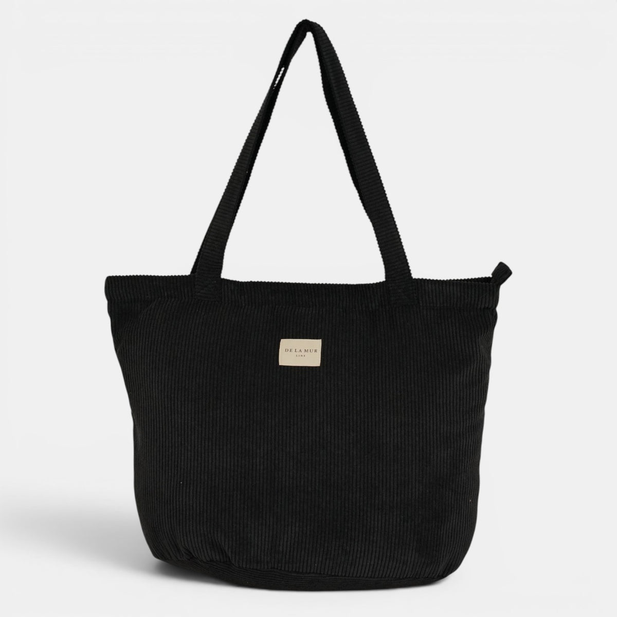 Bolsa grande con cremallera Nit, estampado en negro, blanco, beige, detalle del estampado y el material — De La Mur