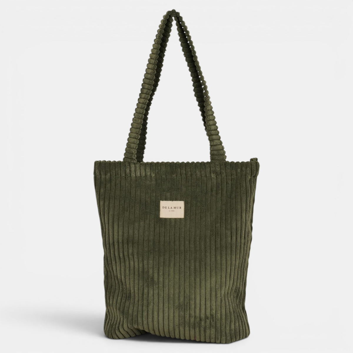 Bolsa pequeña Musgo, acabado verde musgo, detalle del estampado y el material — De La Mur