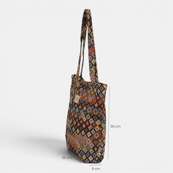 Bolsa pequeña Ore, estampado en beige, negro, marrón, detalle del material y el acabado — De La Mur