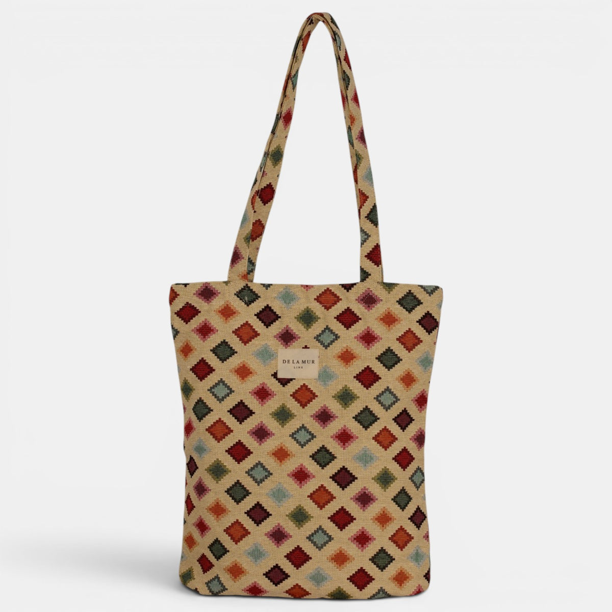 Bolsa pequeña Zac, estampado en beige, azul, terracota, detalle del estampado y el material — De La Mur