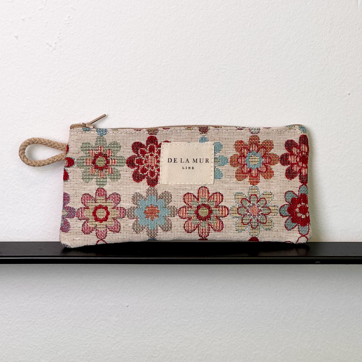 Monedero Isla, estampado en beige, rojo, negro, vista frontal — De La Mur