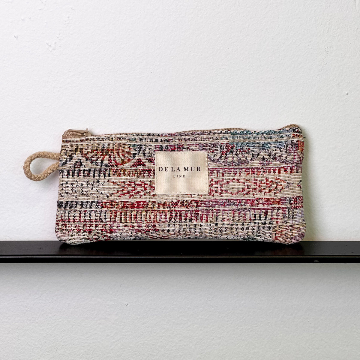 Monedero Sira, estampado en beige, negro, marrón, vista frontal — De La Mur