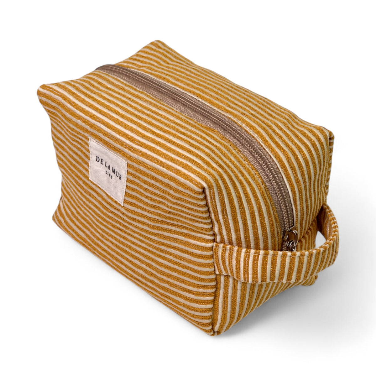 Neceser mediano Acel, estampado en naranja, beige, terracota, detalle del estampado y el material — De La Mur