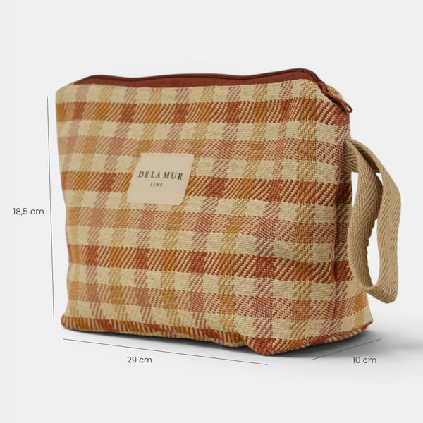 Neceser Zia, estampado en blanco, naranja, terracota, vista en uso — De La Mur