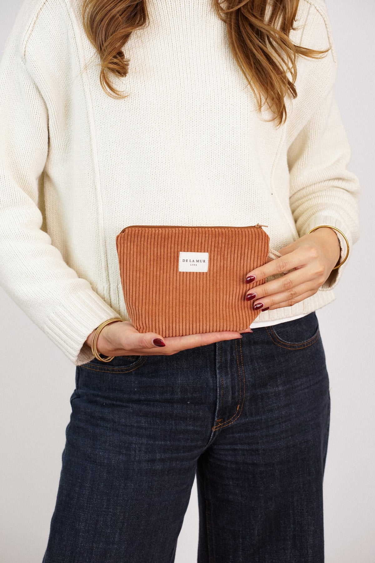 Neceser Barro, estampado en terracota, blanco, naranja, detalle del material y el acabado — De La Mur