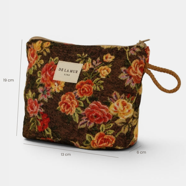 Neceser Pepi, estampado en blanco, naranja, terracota, vista en uso — De La Mur