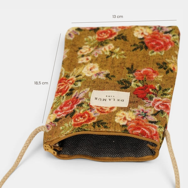 Bolsito porta móvil Esme, estampado en blanco, naranja, terracota, vista en uso — De La Mur