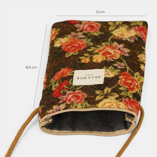 Bolsito porta móvil Pepi, estampado en blanco, naranja, terracota, vista en uso — De La Mur