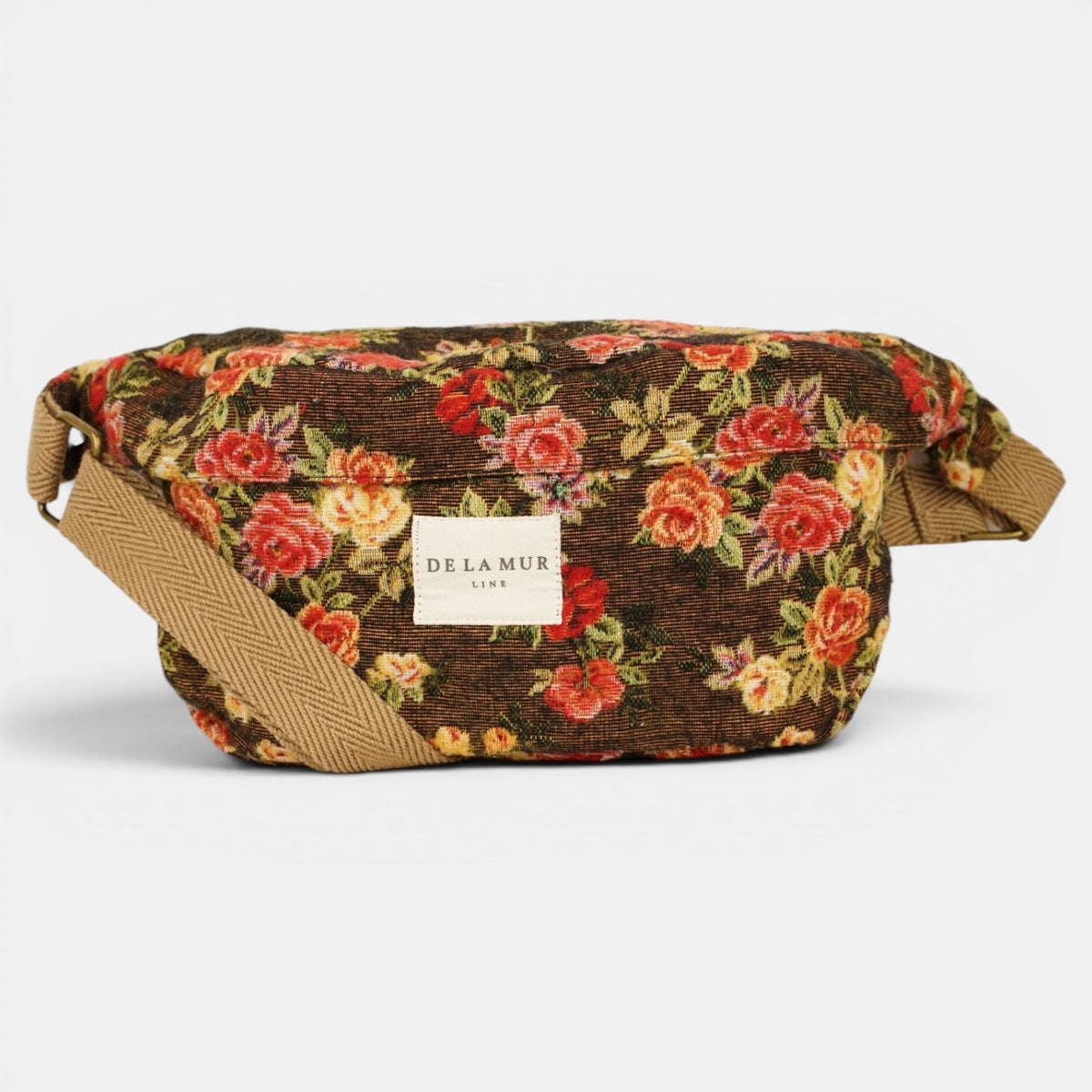 Riñonera Pepi, estampado en negro, blanco, naranja, detalle del estampado y el material — De La Mur