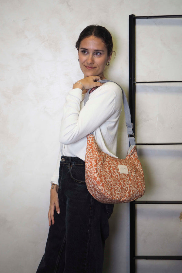 Was bag, print in terracotta, red and brown, in use — De La Mur